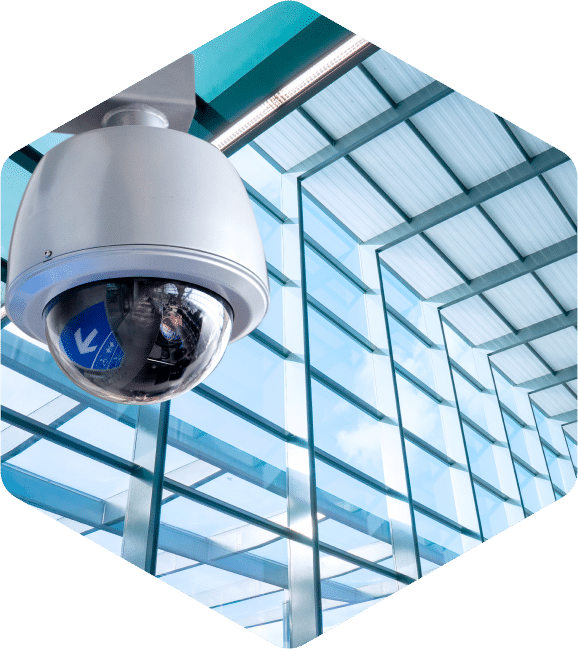 CCTV security camera with open windows in the background.
