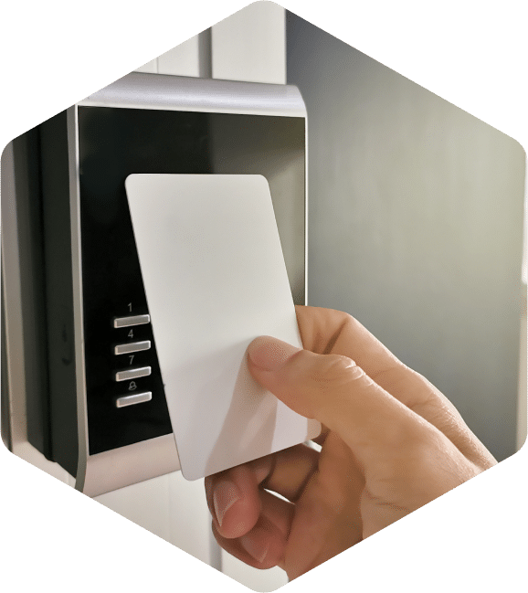 Keycard lays against a card reader to gain access through a security door.