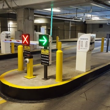 Controlled access with direction signs lit up for safe and secure parking.