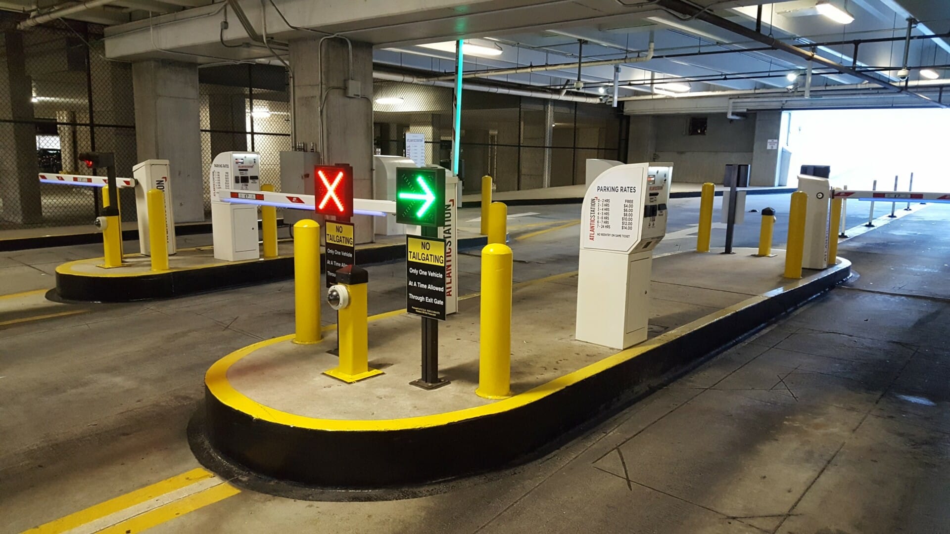 Controlled access with direction signs lit up for safe and secure parking.