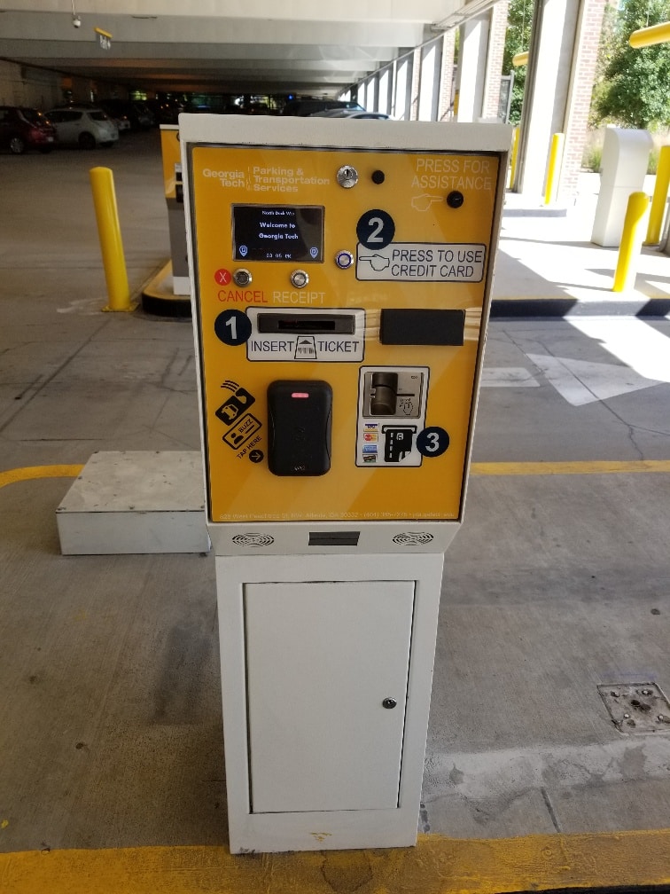 Insert your ticket and pay parking fees with a credit card.