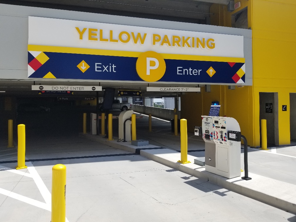 Enter and exit secure parking with controlled access systems on respective traffic lanes.