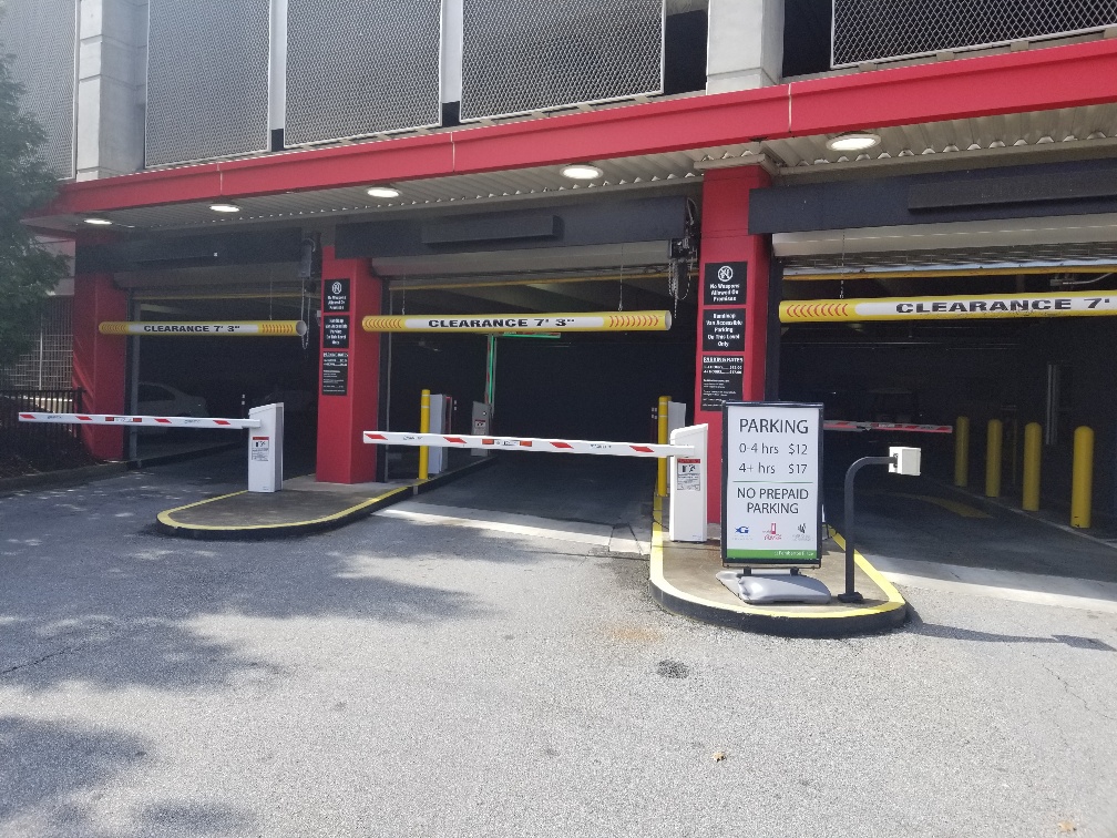 Secure parking with operational lift arms and overhead security gates for closure.