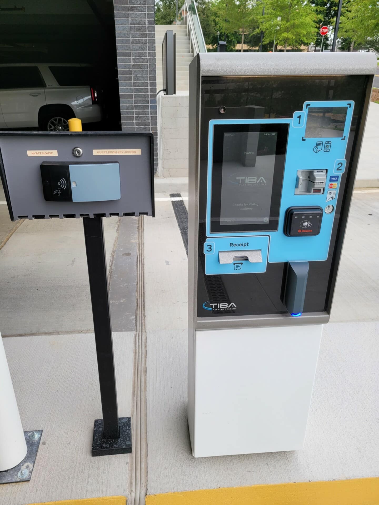 Remote access receiver and touchless payment scanner offer options for secure parking.