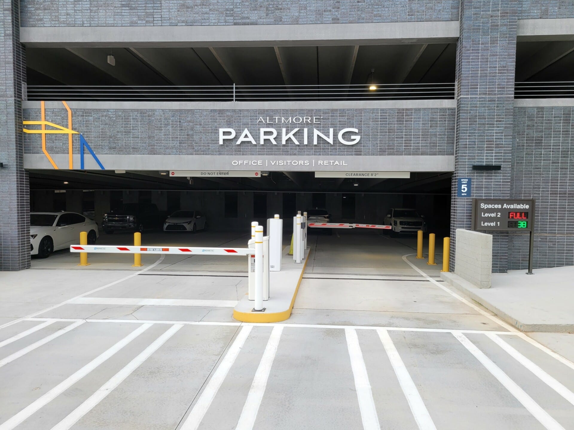 Digital sign shows Full or number of available parking spaces in a secure parking area with parking space tracking.