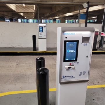 Push the button on the ticket machine and grab your ticket for the secure parking area.