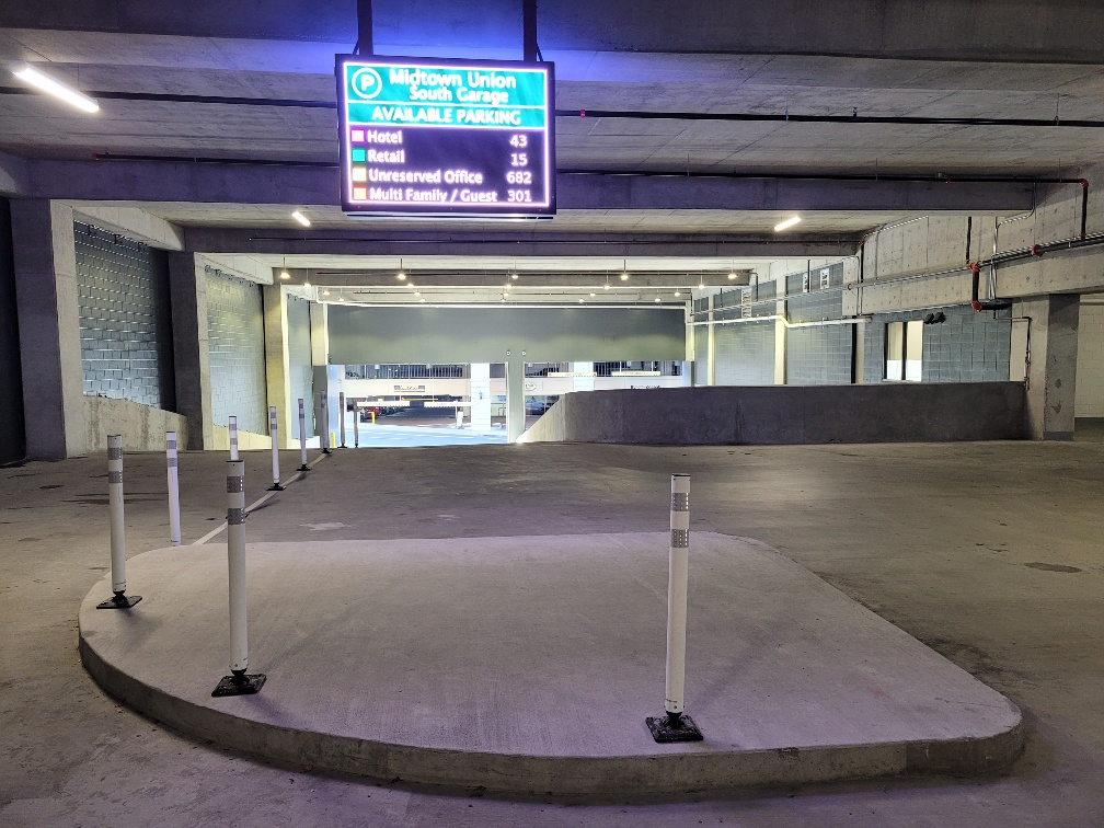 Digital parking display with available parking in secure parking area.