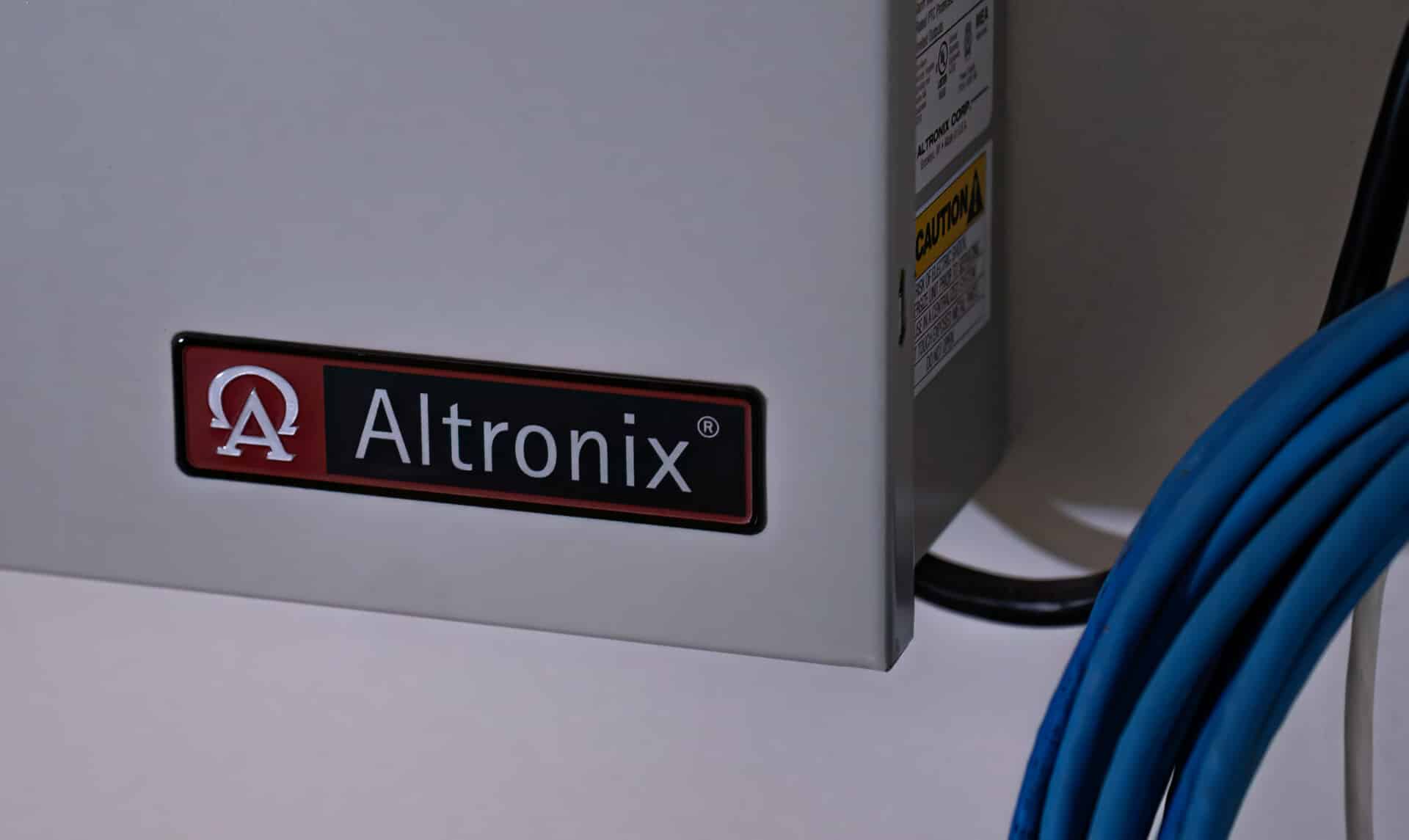 Altronix brand name on security panel door.