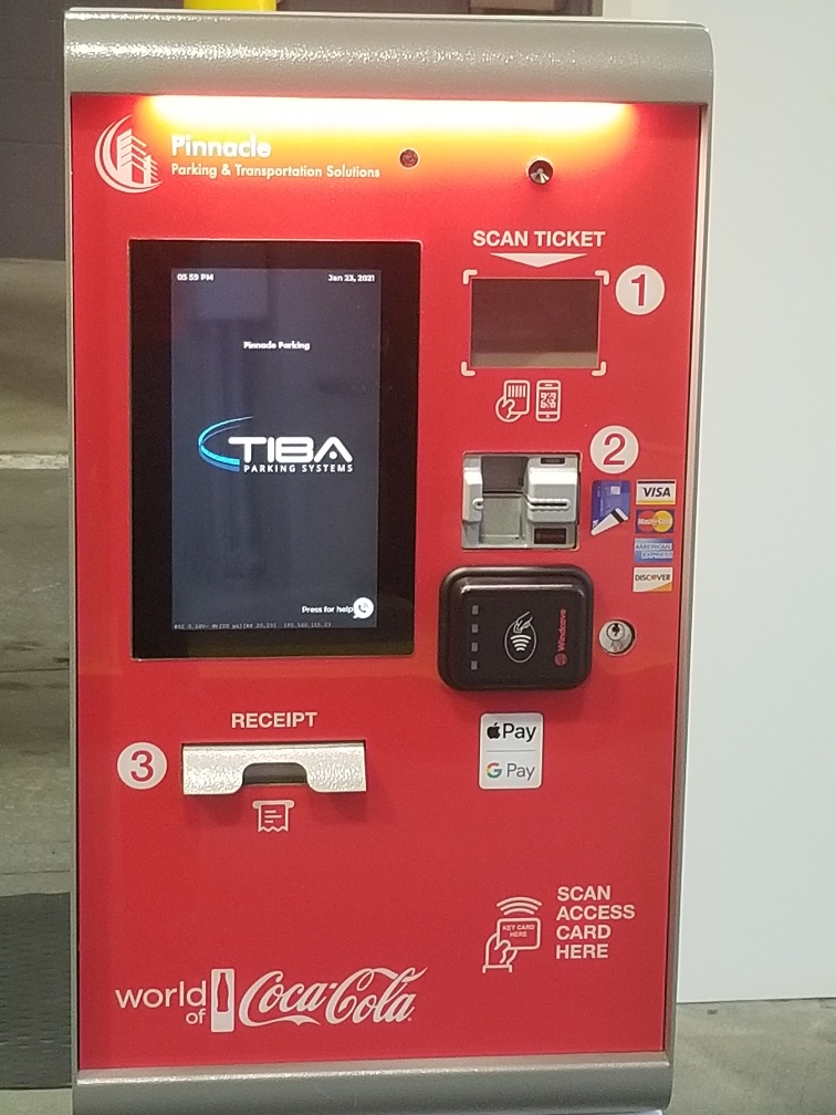 Red ticket payment system with digital interactive screen.