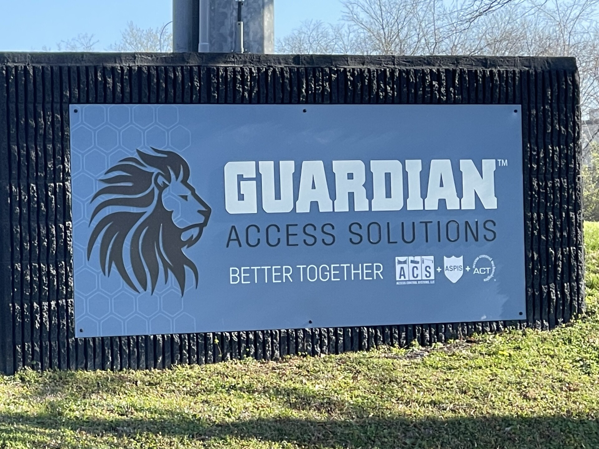 Guardian Access Solutions business merger sign with ACS, ASPIS, and ACT.
