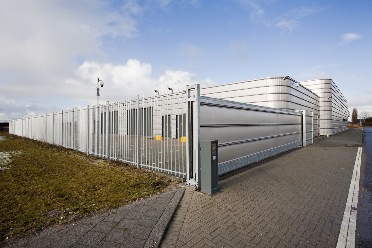 Business secured with metal security gate, with scanner access.