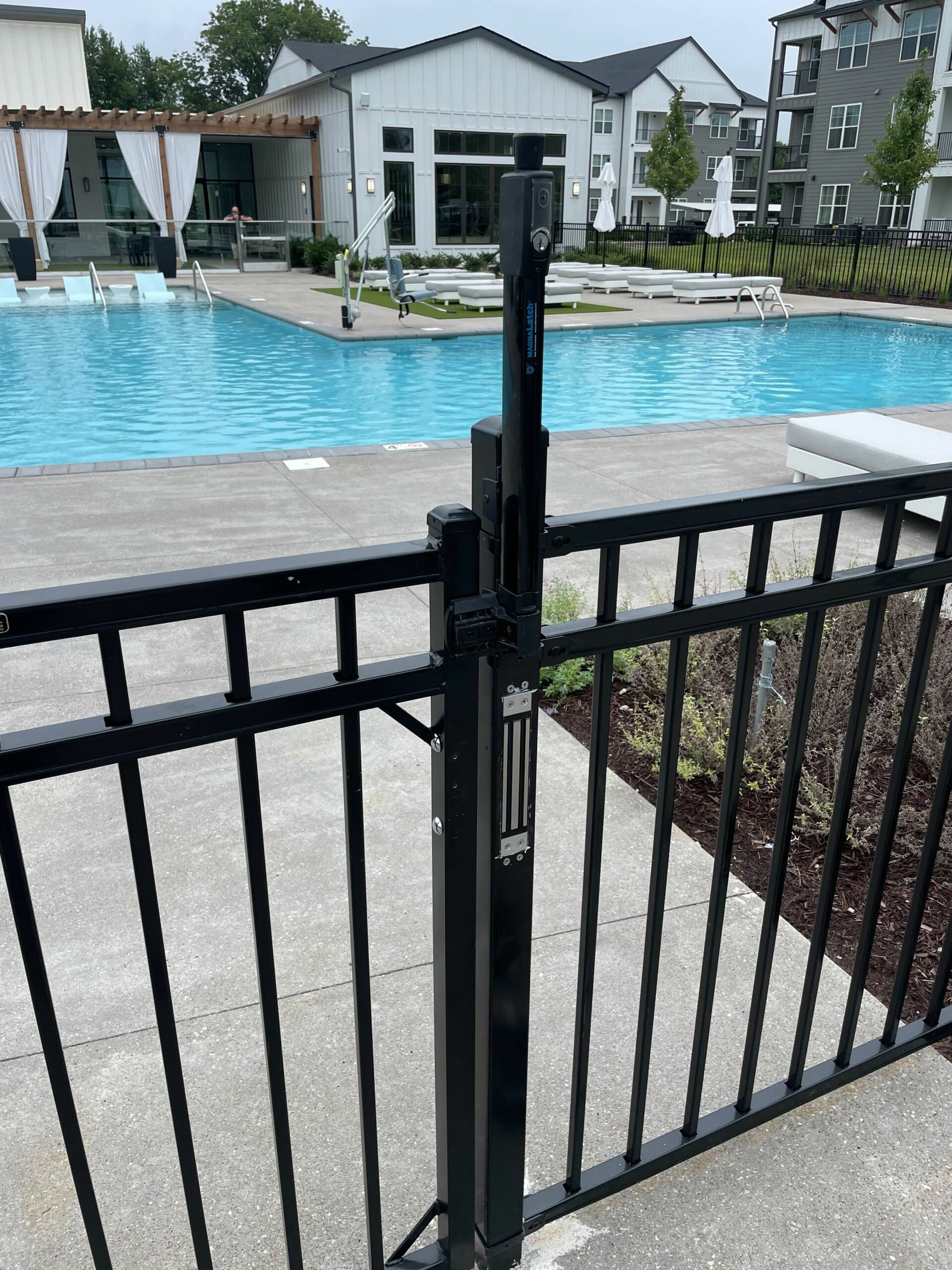 Community pool area with controlled access entry installed by Guardian.