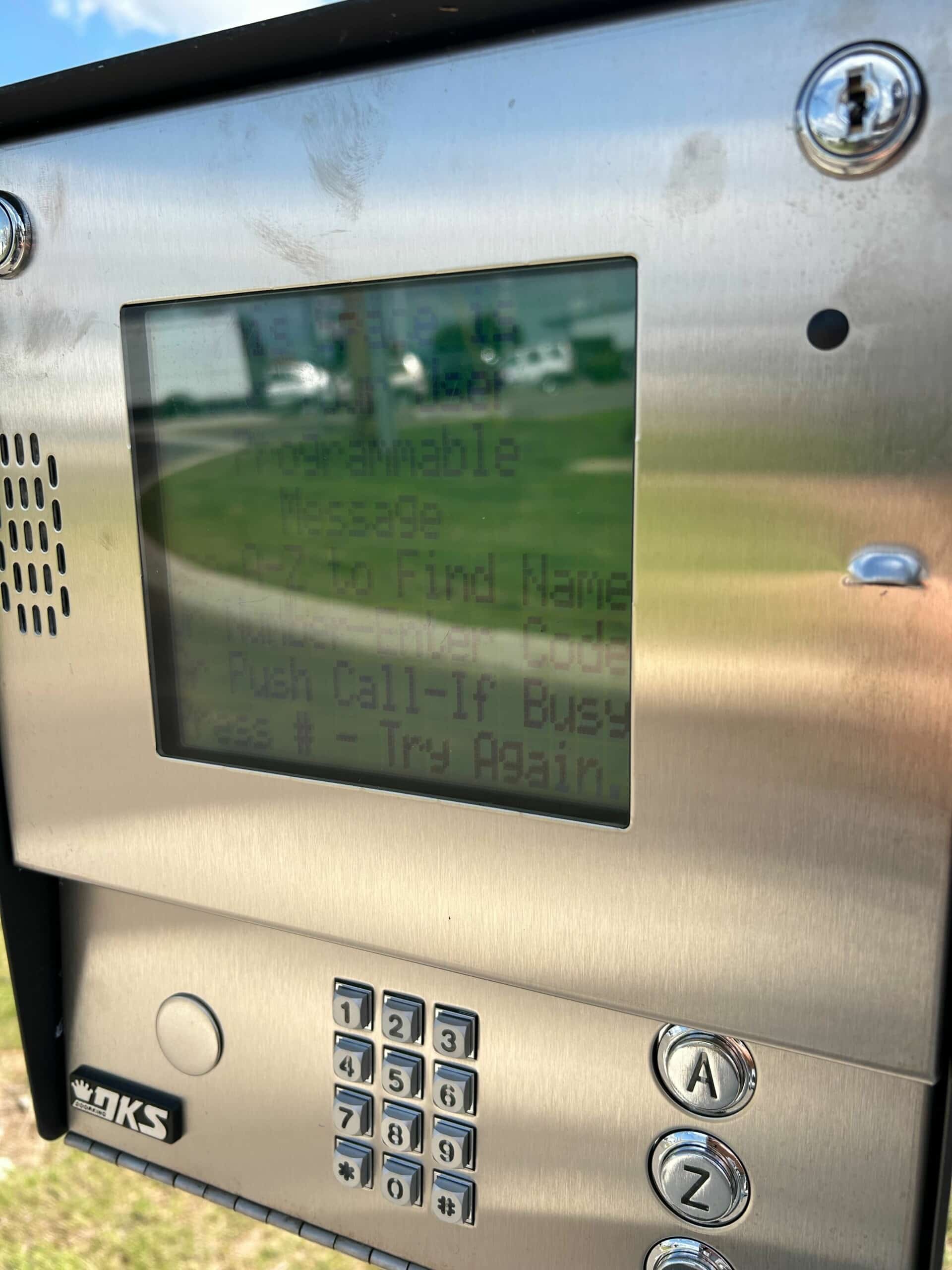 Keypad with intercom feature installed at apartment for access control.