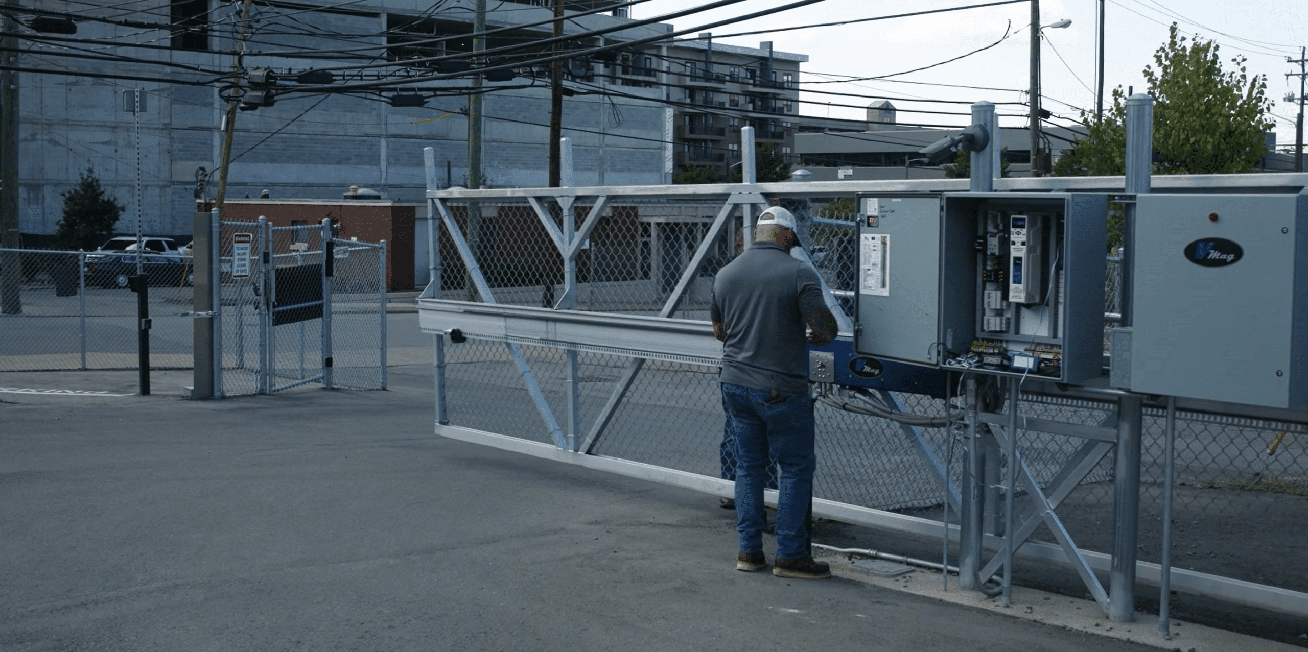 Guardian installation tech installs automatic gate at an industrial location.
